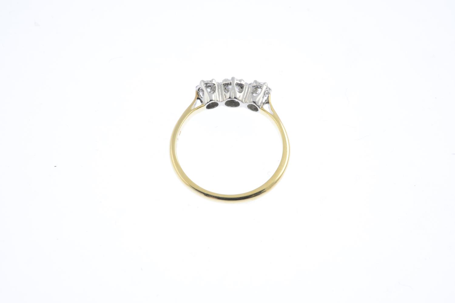 A diamond three-stone ring. Designed as a brilliant-cut diamond graduated line., with tapered - Image 2 of 3