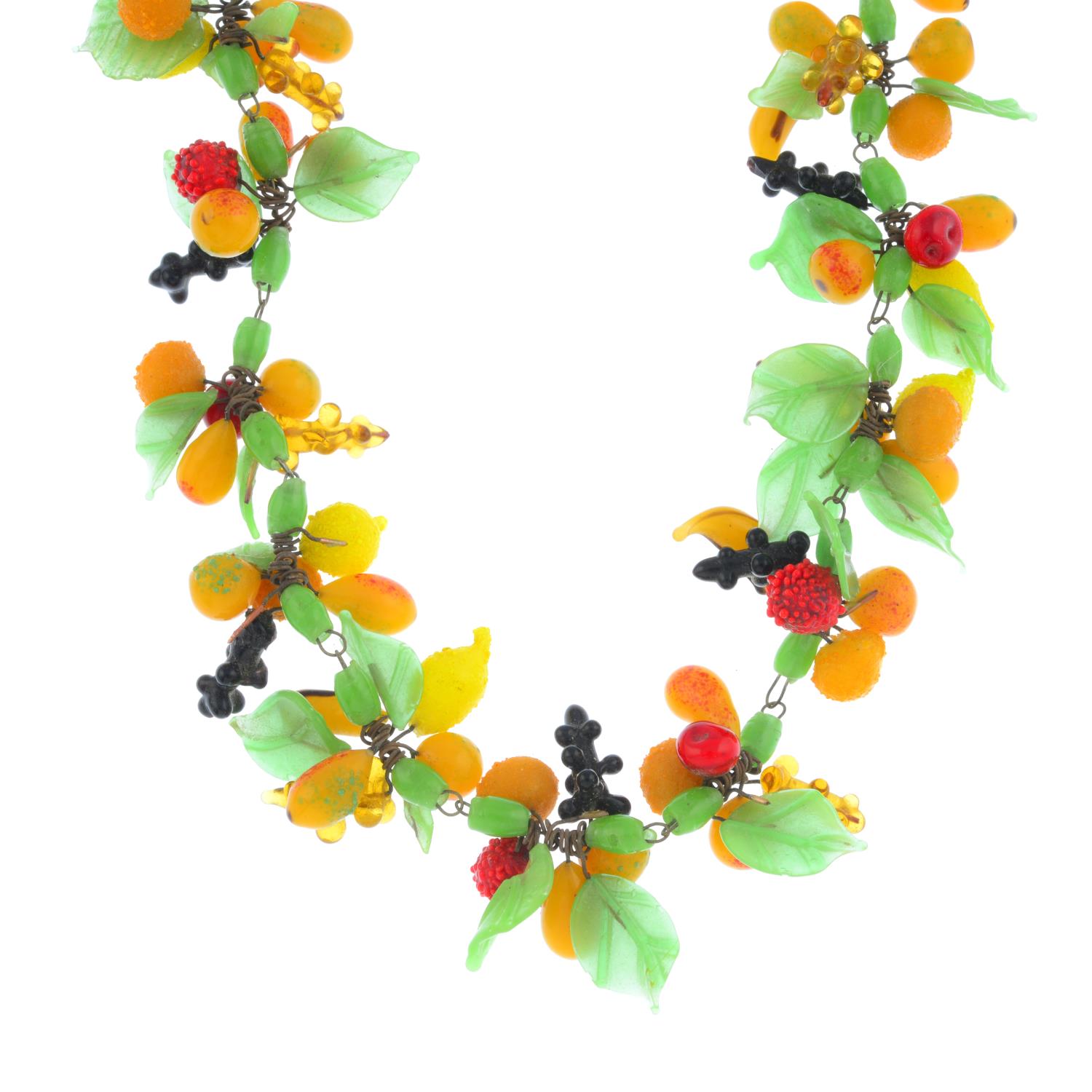 An early 20th century glass necklace. Designed as a series of bunches of fruit, with foliate