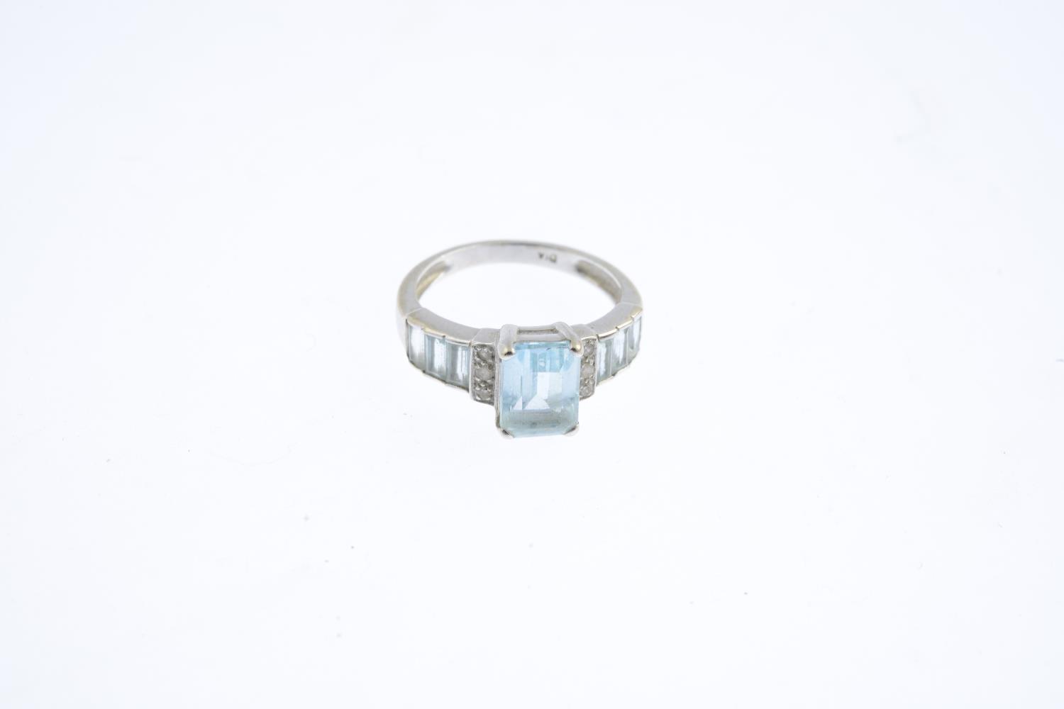 A 9ct gold topaz and diamond ring. The rectangular-shape blue topaz, with pave-set diamond line - Image 3 of 3