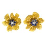 A pair of sapphire and diamond floral earrings. Each designed as a single-cut diamond and circular-
