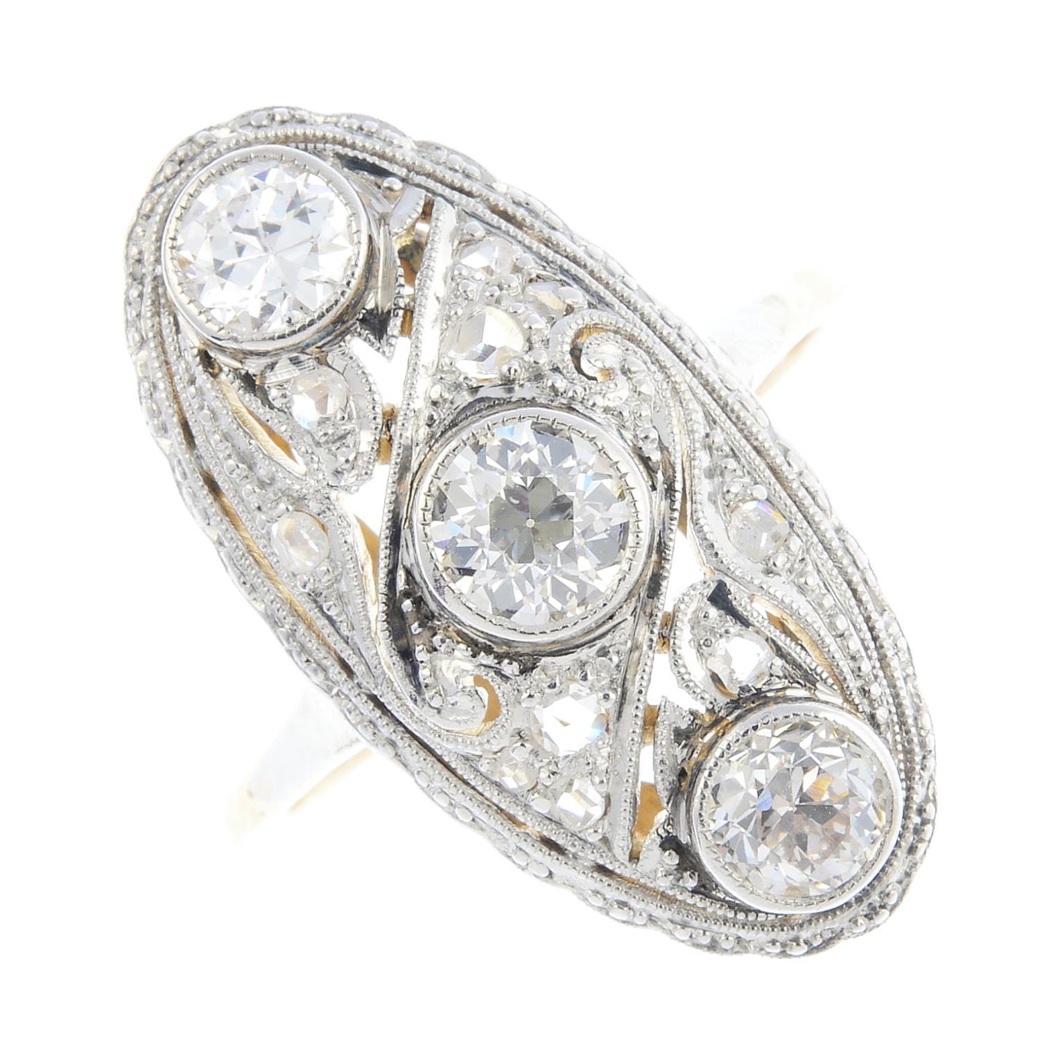 An early 20th century platinum and gold diamond dress ring. The circular-cut diamond collet line,