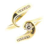 Two 18ct gold diamond rings. The first designed as a brilliant-cut diamond with similarly-cut