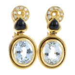 A pair of diamond and gem-set earrings. Each designed as an oval-shape blue topaz, suspended from an