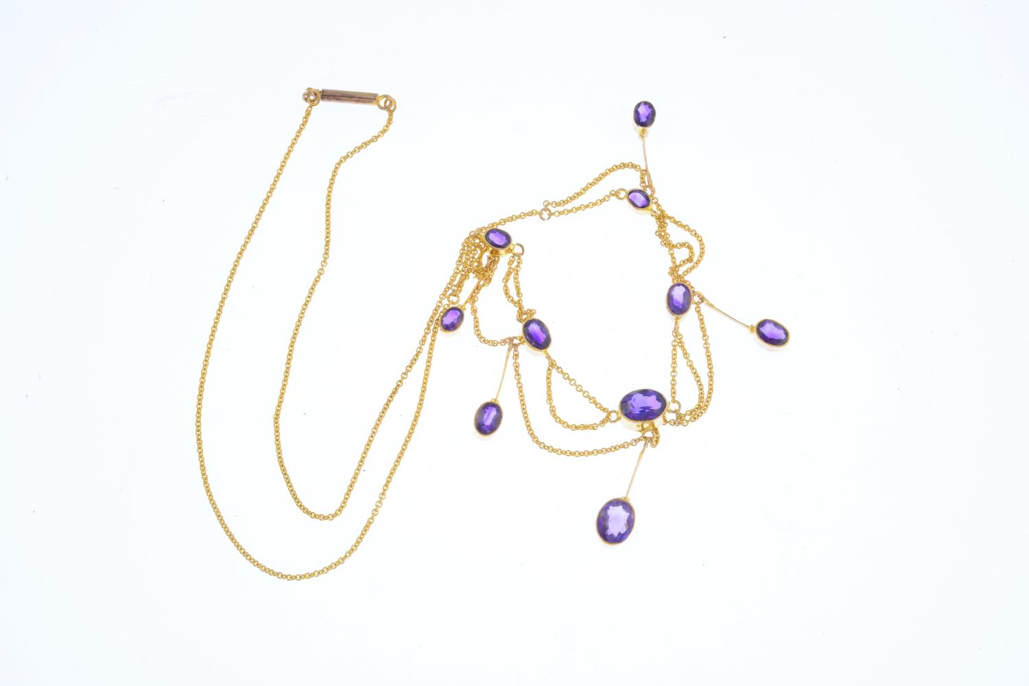 An Edwardian 9ct gold amethyst necklace. Designed as a graduated oval-shape amethyst fringe and - Image 2 of 2