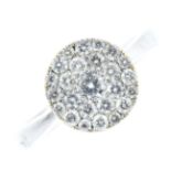 A 9ct gold diamond dress ring. Of circular outline, designed as a brilliant-cut diamond, within a