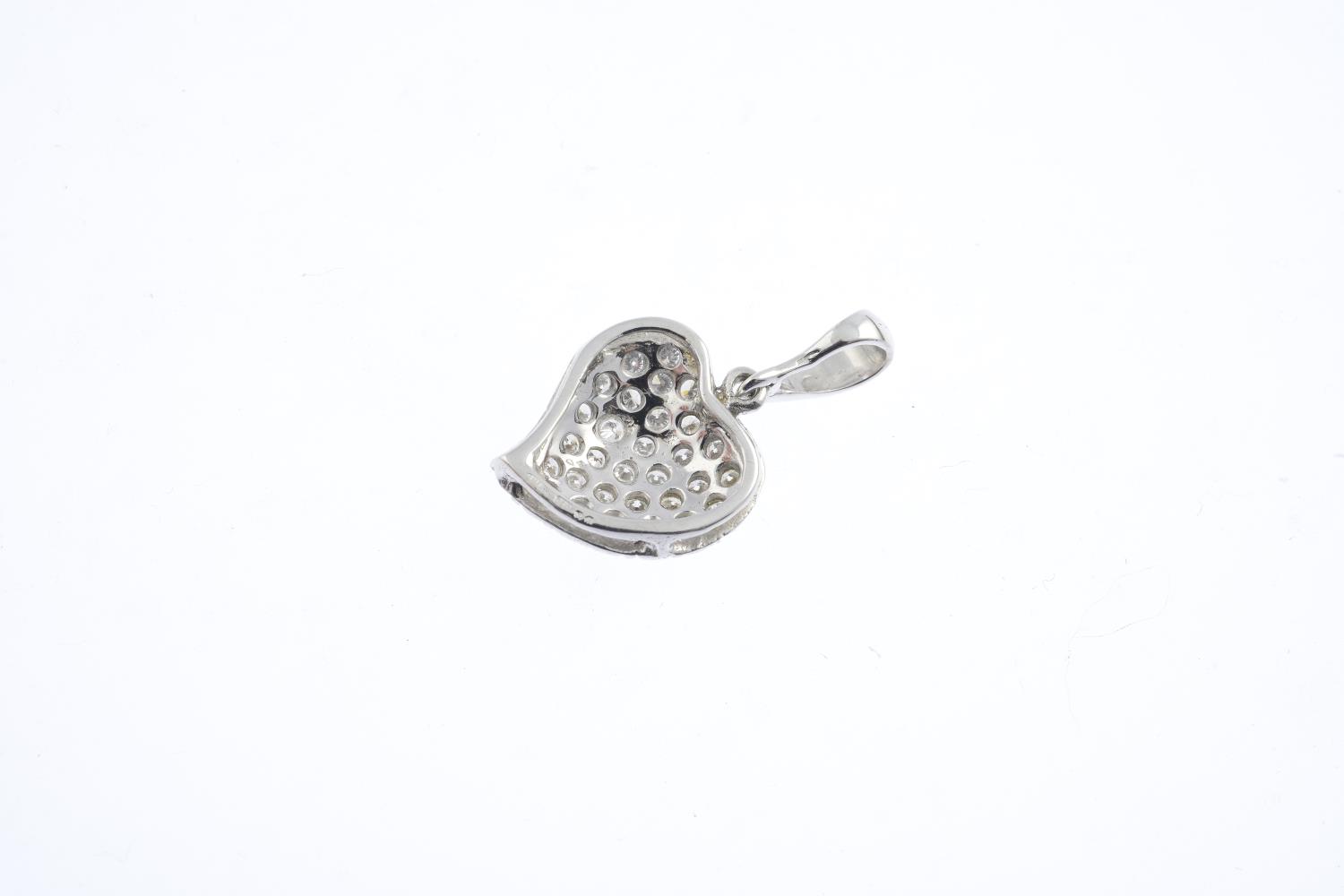 An 18ct gold diamond pendant. The pave-set diamond stylised heart, suspended from a tapered - Image 2 of 2