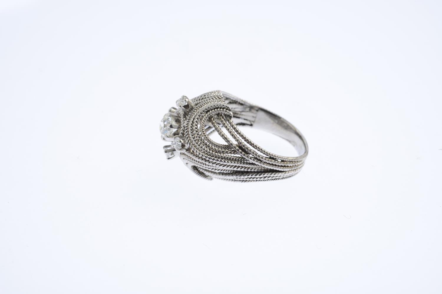 A diamond dress ring. The old-cut diamond, with brilliant-cut diamond quatrefoil surround and rope- - Image 2 of 3