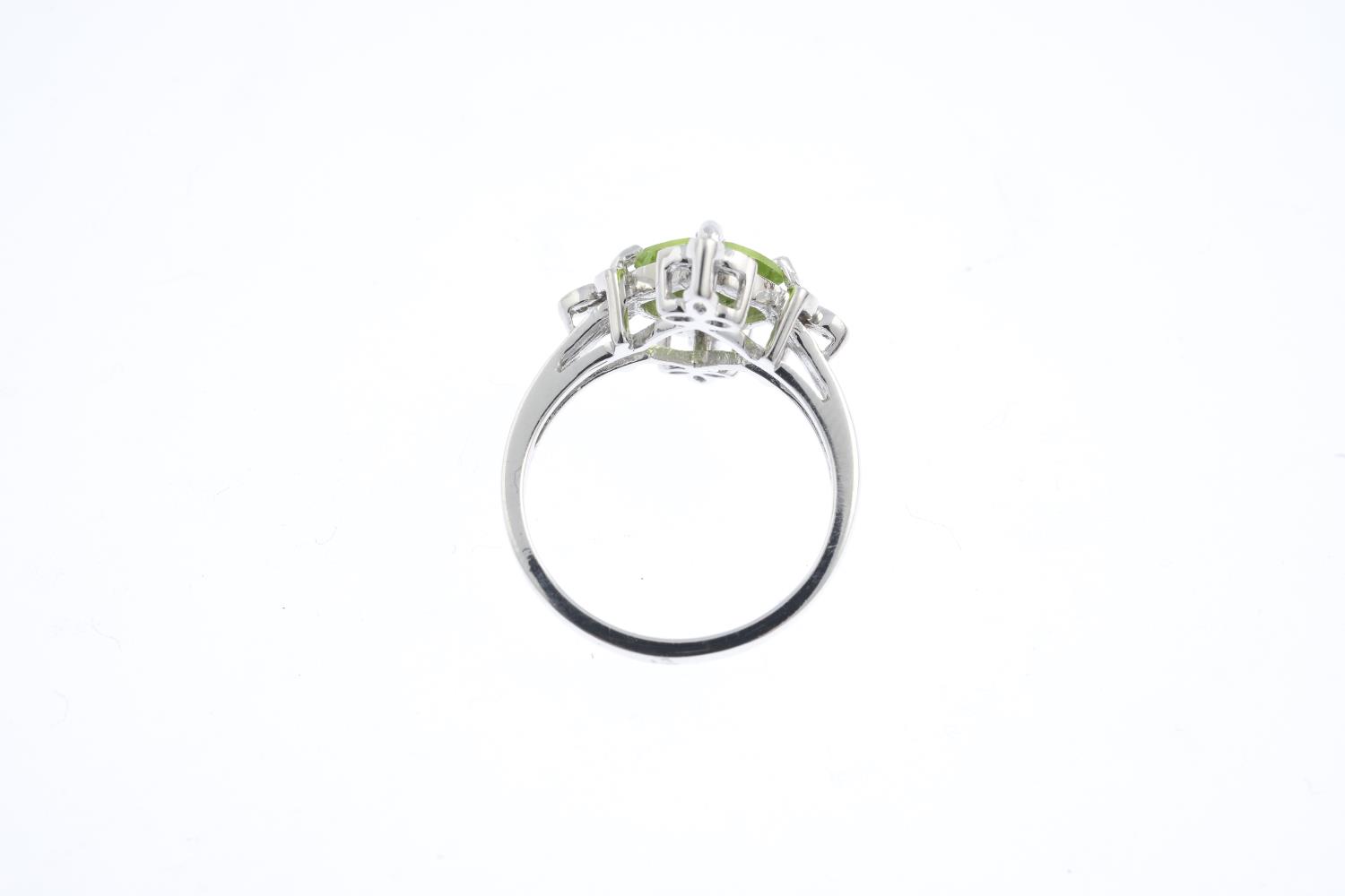 An 18ct gold peridot and diamond dress ring. The square-shape peridot, with single-cut diamond - Image 2 of 3