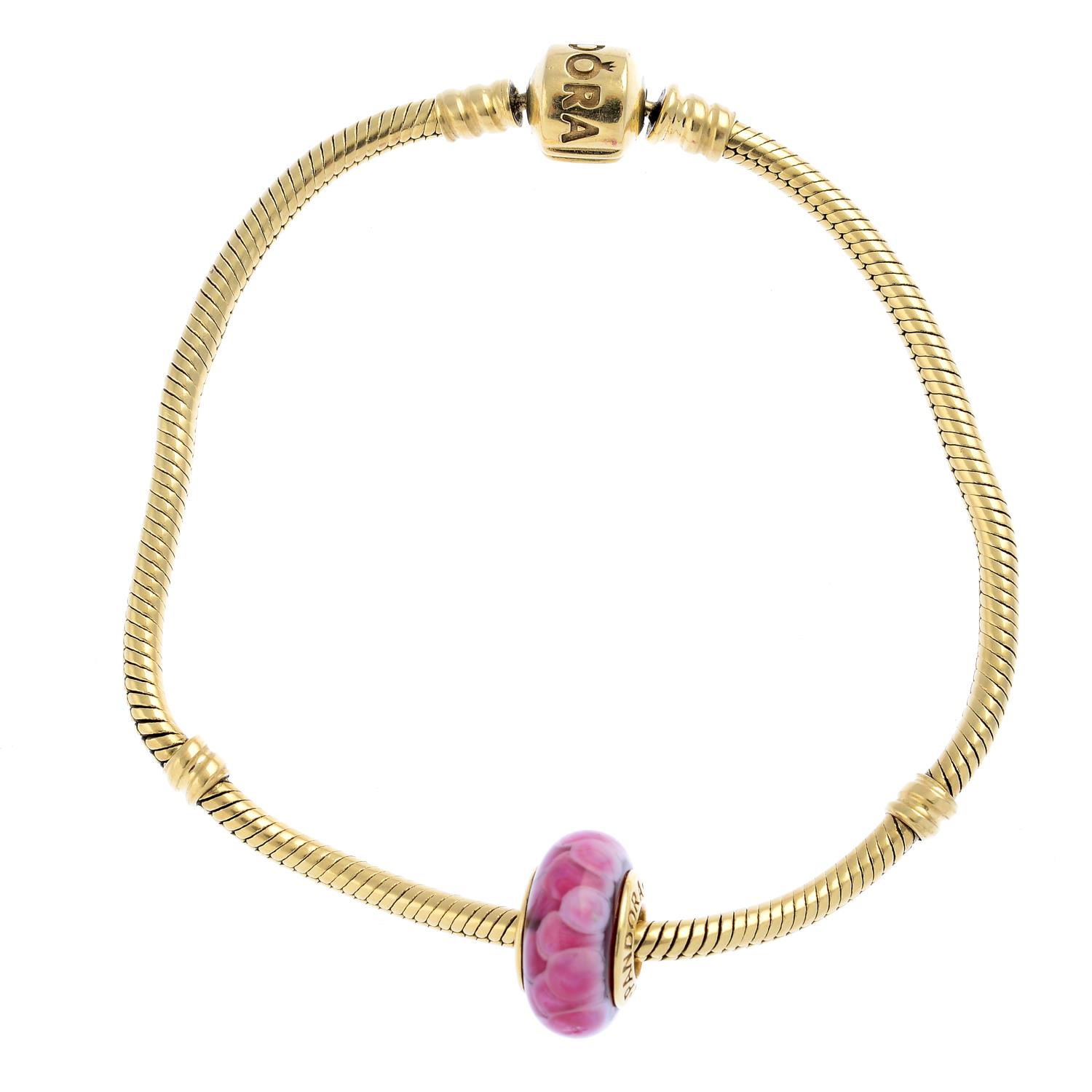 PANDORA - a bracelet and two charms.
