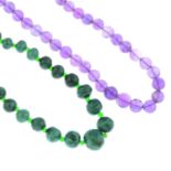 A selection of malachite jewellery and an amethyst bead necklace.