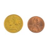 (210751) An American five dollar coin and a one cent coin.