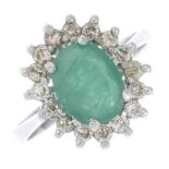 An emerald and diamond cluster ring.