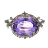 An amethyst and diamond brooch.