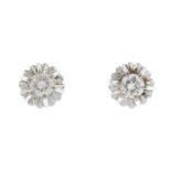 A pair of diamond earrings.