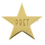 TIFFANY & CO. - a badge. Designed as a star with 'PRET' engraved to centre. Length 2.5cms. Weight