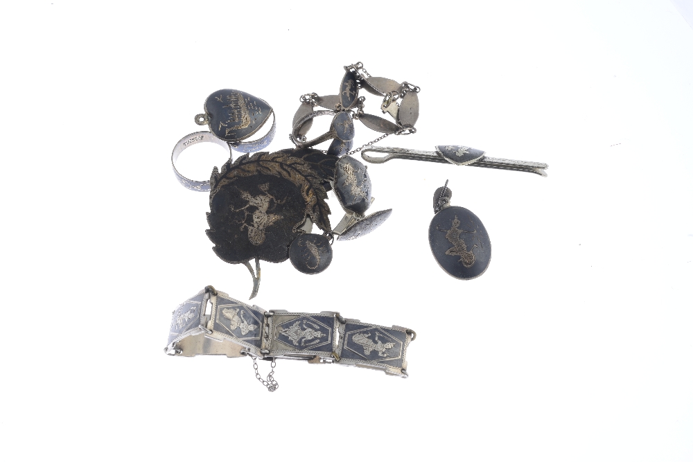 A selection of silver and white metal Siam jewellery. To include a niello brooch of circular - Image 2 of 2