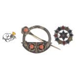 Nine mainly Scottish silver and white metal brooches. To include a coral tara brooch featuring a