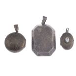 Forty silver and white metal lockets. To include silver circular domed locket with an engraved