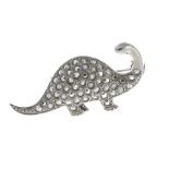 A selection of paste costume jewellery. To include a paste novelty brooch of a dinosaur, a pair of