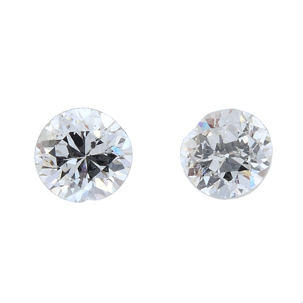Two circular-cut diamonds, total weight 0.42ct. Estimated I-J colour, P1 clarity. PLEASE NOTE THIS