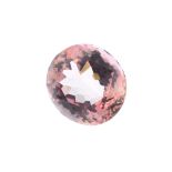 An oval-shape pink tourmaline, weighing 5.13cts. Approximate dimensions 11.5 by 10.3 by 6.4mms.