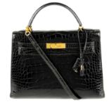 HERMÈS - a 1991 black Porosus Crocodile Kelly 32 handbag.