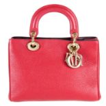 CHRISTIAN DIOR - a red Mini Diorissimo handbag.