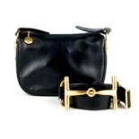 GUCCI - a black horsebit bag with matching belt.