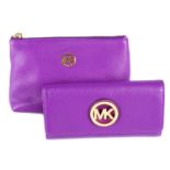 MICHAEL KORS - a purple wallet and matching cosmetics pouch.