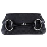 GUCCI - a black canvas Horsebit clutch.