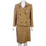 CHANEL - a beige and multicoloured boucle wool skirt suit.