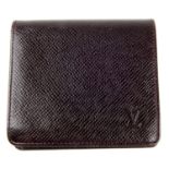 LOUIS VUITTON - a brown Taiga Bifold wallet.