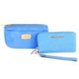 MICHAEL KORS - a blue wallet and matching travel pouch.