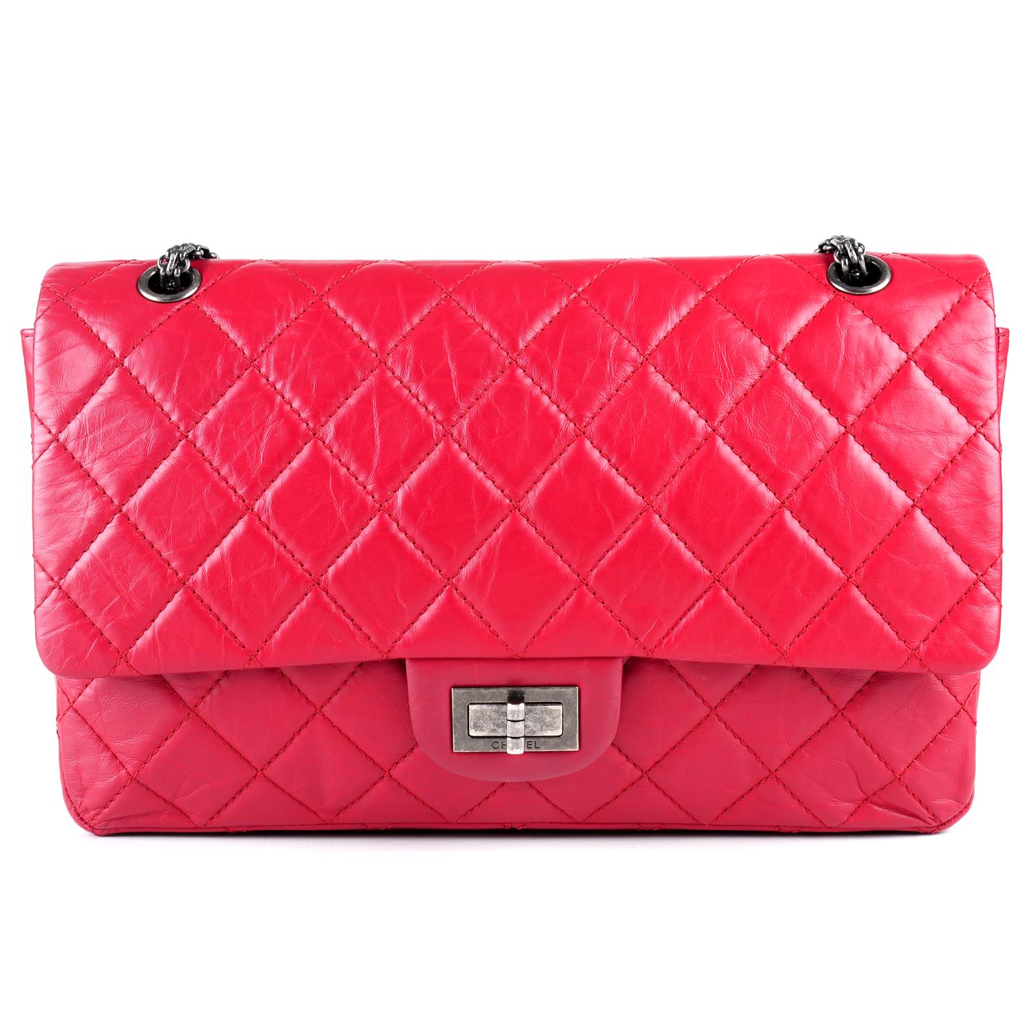 CHANEL - a red 2.55 Reissue 227 handbag.