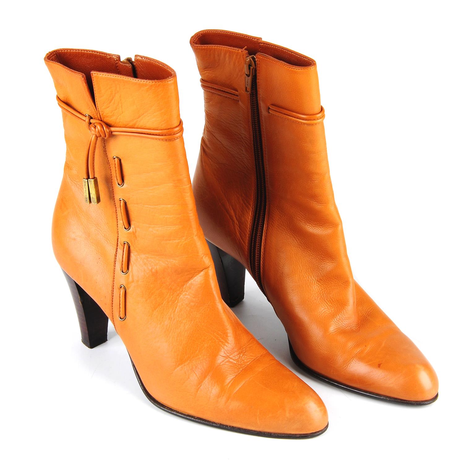 BALENCIAGA - a pair of tan leather ankle boots.