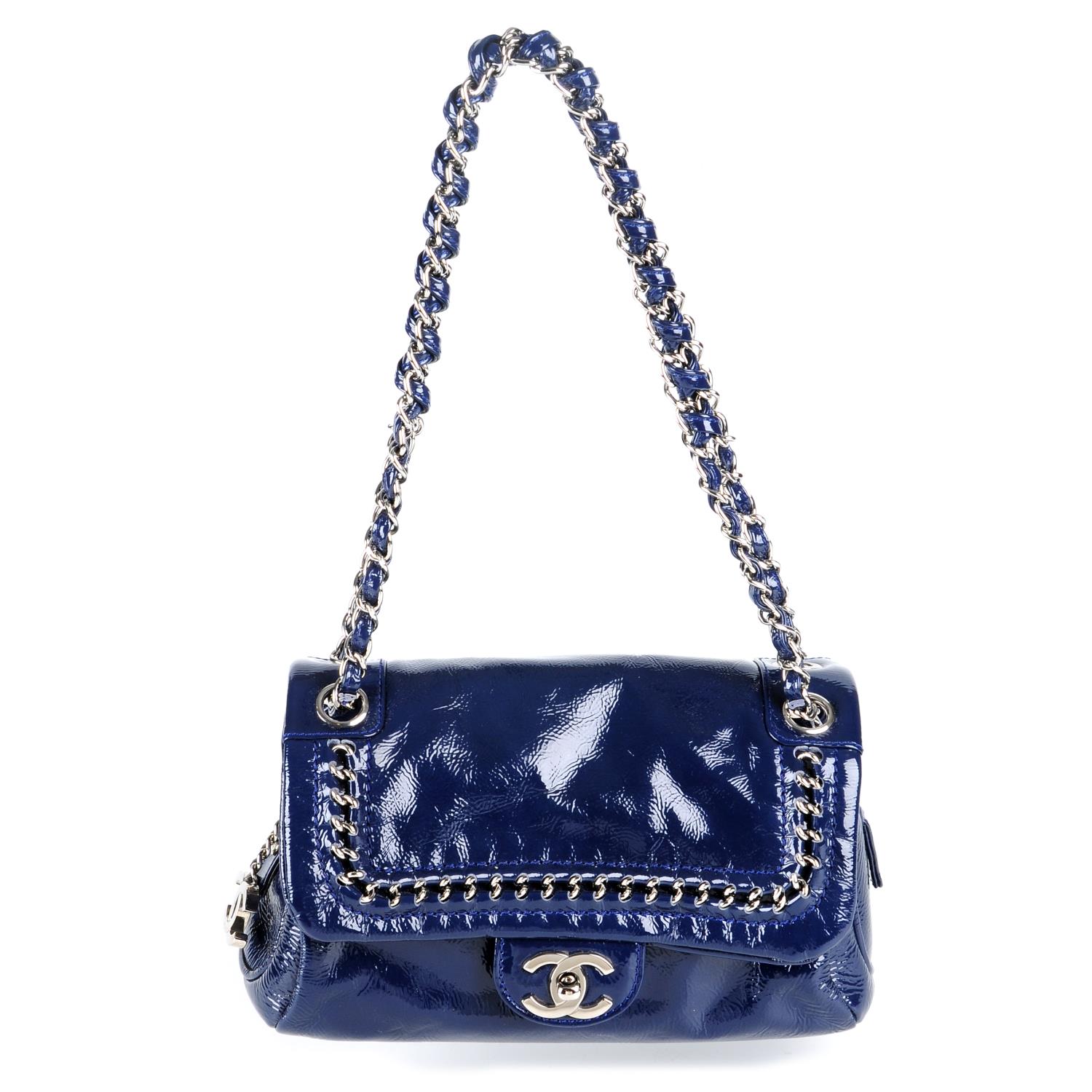 CHANEL - a small Luxe Ligne Flap handbag.