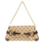 GUCCI - a canvas Horsebit clutch.