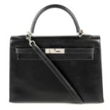 HERMÈS - a 2006 black Box Calf Kelly Sellier 32 handbag.