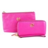 MICHAEL KORS - a pink wallet and matching cosmetics pouch.
