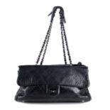 CHANEL - a black Quilted Ritz Flap handbag.