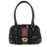 GUCCI - a Reins handbag.