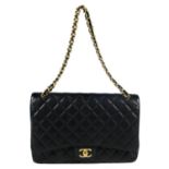 CHANEL - a Caviar Maxi Double Flap handbag.