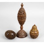 A carved and pierced coquilla nut reliquary,