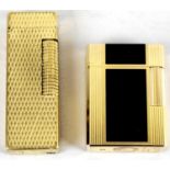 Two gold plated cigarette lighters,