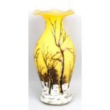 A reproduction Daum Nancy Art Nouveau style yellow cased glass vase of ovoid form with flared