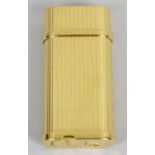 A Cartier gold plated cigarette lighter,