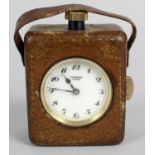 An unusual late 19th/early 20th century pocket travel clock,