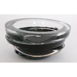 A contemporary Rosenthal Studio Line glass bowl of slice cut construction in a black and clear