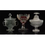 An 18th Century glass lidded twin handled pedestal bowl with an engraved border above basal