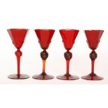 A set of four early 20th Century Salviati wine glasses the spread foot below the drawn stem to a
